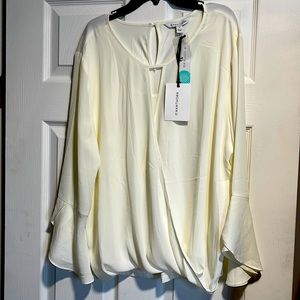 Pretty dressy blouse with scalloped sleeves. Size xl, new with tags
